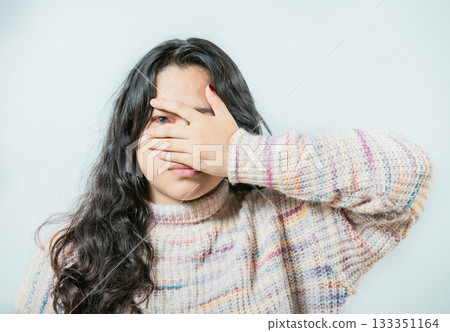 Close up of woman with conjunctivitis isolated. Female with eye infection looking at camera Close up of woman with conjunctivitis isolated. Female with eye infection looking at camera 133351164