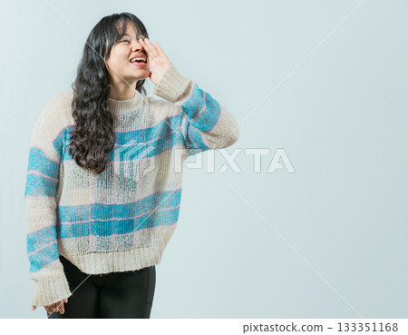Beautiful asian girl shouting a promotion isolated. Young asian woman shouting an announcement Beautiful asian girl shouting a promotion isolated. Young asian woman shouting an announcement 133351168