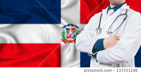 Dominican Republic healthcare concept. Male doctor on Dominican Republic flag. Doctor with crossed arms on Dominican Republic flag Dominican Republic healthcare concept. Male doctor on Dominican Republic flag. Doctor with crossed arms on Dominican Republic flag 133351286