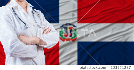 Doctor with crossed arms on Dominican Republic flag. Dominican health and care concept. Female doctor on Dominican Republic flag Doctor with crossed arms on Dominican Republic flag. Dominican health and care concept. Female doctor on Dominican Republic flag 133351287