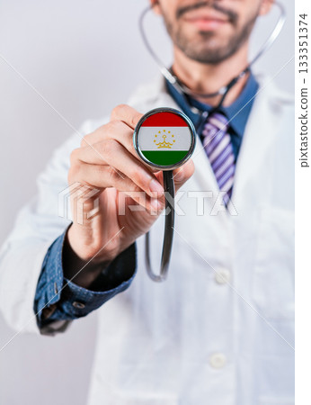 Tajikistan health and medical insurance concept. Tajikistan healthcare system, doctor holding stethoscope Tajikistan health and medical insurance concept. Tajikistan healthcare system, doctor holding stethoscope 133351374