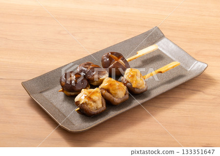 Shiitake mushroom meatballs and grilled skewers 133351647