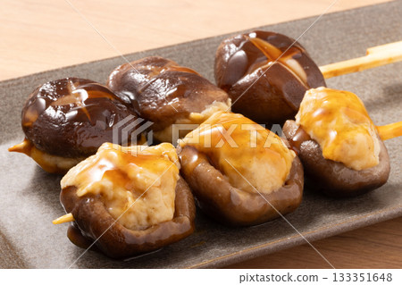 Shiitake mushroom meatballs and grilled skewers 133351648