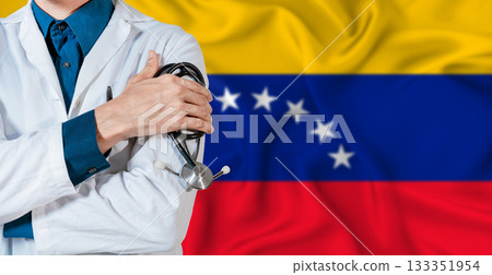 Venezuela healthcare concept. Doctor with stethoscope on Venezuela flag. Doctor holding stethoscope on Venezuelan flag Venezuela healthcare concept. Doctor with stethoscope on Venezuela flag. Doctor holding stethoscope on Venezuelan flag 133351954