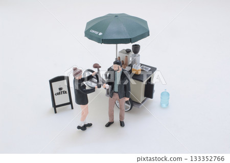Mini Coffee Cart With Umbrella and Playful Miniature Figures in Street Scene 133352766