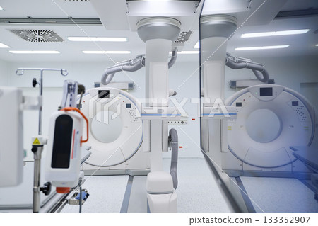 Advanced medical imaging equipment in a modern hospital room during the day 133352907