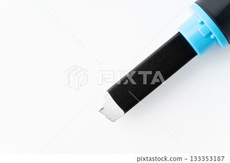 Close-up of the cutting edge of a carving knife on a white background 133353187