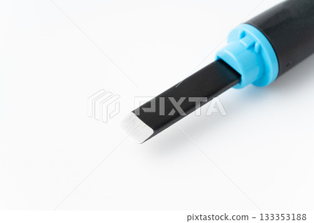 Close-up of the cutting edge of a carving knife on a white background 133353188