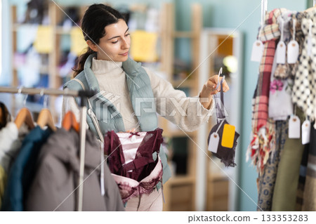 Regular customer Armenian woman chooses color and style of bra 133353283