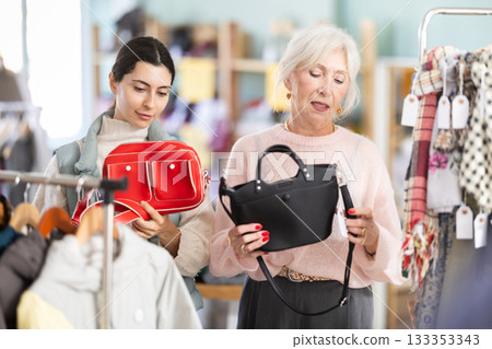 Regular customer mature woman and Armenian girl choose color and style of handbag 133353343