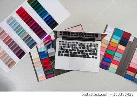 Laptop and fabric color swatches on white background, product photo isolated, mockup background, clean studio background, copy space minimal background, design concept. Laptop and fabric color swatches on white background, product photo isolated, mockup background, clean studio background, copy space minimal background, design concept. 133353422