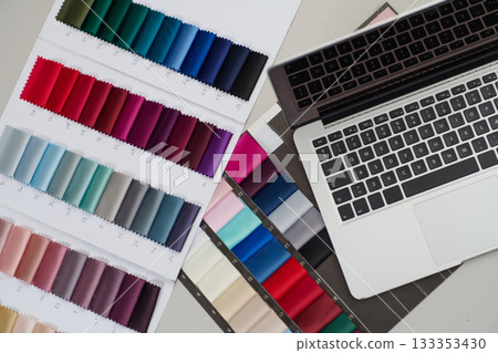 Fabric swatches and laptop for design project, material samples with color palette and computer, textile selection for interior, fashion, isolated background, product photo 133353430