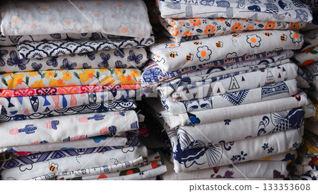 heap of colorful cloth on shelf for sale in store heap of colorful cloth on shelf for sale in store 133353608