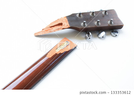 part of broken wood acoustic guitar isolated on white background part of broken wood acoustic guitar isolated on white background 133353612