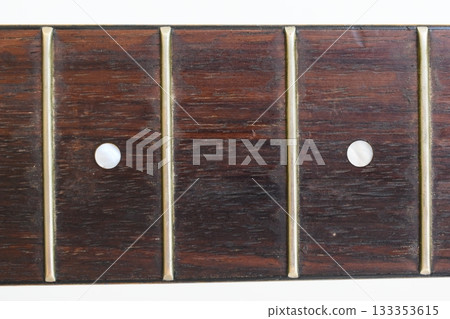 part of brown wood acoustic guitar isolated on white background 133353615