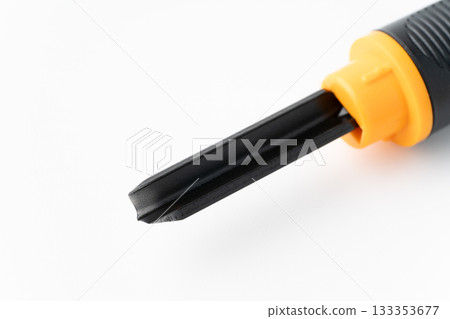 Close-up of the cutting edge of a triangular carving knife on a white background Close-up of the cutting edge of a triangular carving knife on a white background 133353677