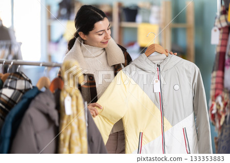 Regular customer Armenian woman chooses color and style of down jacket Regular customer Armenian woman chooses color and style of down jacket 133353883