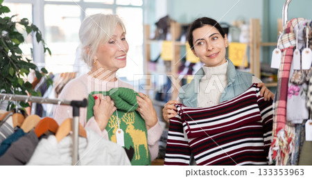 Regular customer mature woman and Armenian girl choose color and style of sweater Regular customer mature woman and Armenian girl choose color and style of sweater 133353963