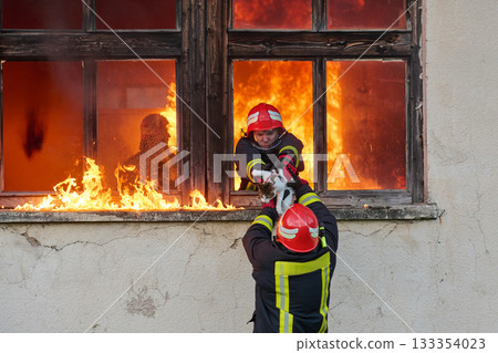 Brave firefighter rescuing a cat from a burning building, visible flames and smoke, dramatic scene, urban environment, emergency response, hero in action, saving lives Brave firefighter rescuing a cat from a burning building, visible flames and smoke, dramatic scene, urban environment, emergency response, hero in action, saving lives 133354023