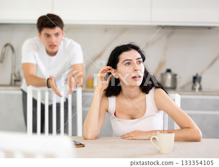 Man quarrels with his wife and shouts at her Man quarrels with his wife and shouts at her 133354105