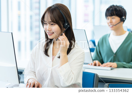 Operator talking on intercom Operator talking on intercom 133354362