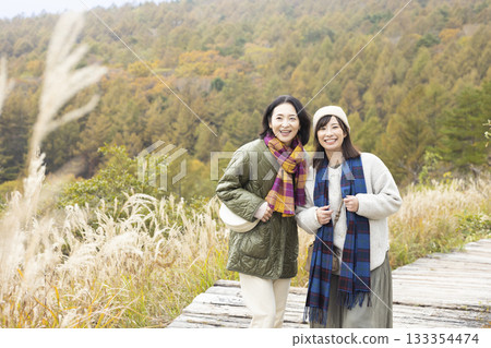 A friendly family taking a walk in nature A friendly family taking a walk in nature 133354474