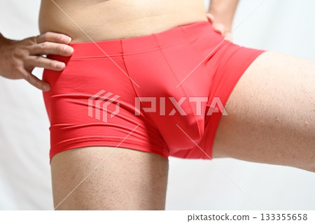 Men and women pinching their belly fat Men and women pinching their belly fat 133355658