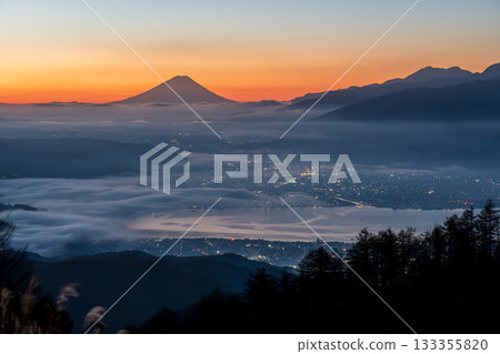 The sea of clouds over Lake Suwa and Mount Fuji towering in the distance from the Takabocchi Plateau at dawn The sea of clouds over Lake Suwa and Mount Fuji towering in the distance from the Takabocchi Plateau at dawn 133355820