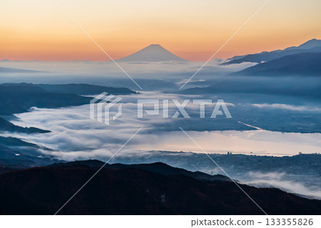 The sea of clouds over Lake Suwa and Mount Fuji towering in the distance from the Takabocchi Plateau at dawn The sea of clouds over Lake Suwa and Mount Fuji towering in the distance from the Takabocchi Plateau at dawn 133355826