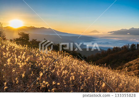 The sea of clouds over Lake Suwa and Mount Fuji towering in the distance from the Takabocchi Plateau at dawn 133355828