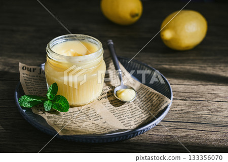 Homemade lemon curd in a glass jar Homemade lemon curd in a glass jar 133356070