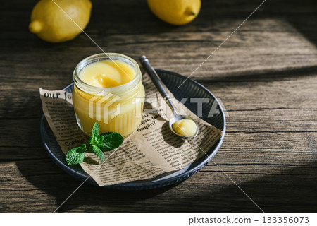 Homemade lemon curd in a glass jar Homemade lemon curd in a glass jar 133356073