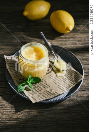 Homemade lemon curd in a glass jar Homemade lemon curd in a glass jar 133356075