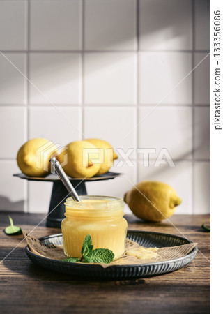 Homemade lemon curd in a glass jar Homemade lemon curd in a glass jar 133356086