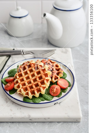 Homemade waffles with lightly salted salmon, spinach and cherry tomatoes Homemade waffles with lightly salted salmon, spinach and cherry tomatoes 133356100
