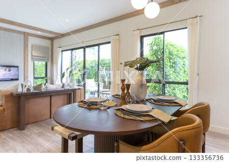 Modern dinning room interior with grey plate on wood table at home. Modern dinning room interior with grey plate on wood table at home. 133356736