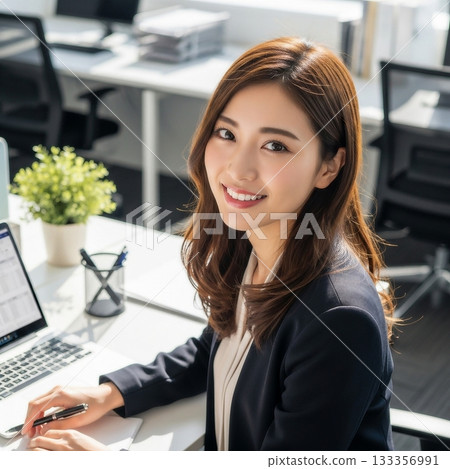 A young Japanese female employee working in the office 133356991