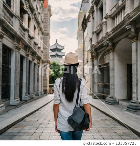 A woman walking in the city 133357725