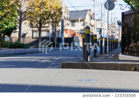Bollards on the sidewalk to prevent cars Bollards on the sidewalk to prevent cars 133358500