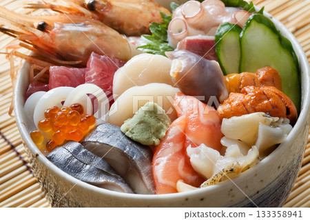 Bowl of rice topped with sashimi Bowl of rice topped with sashimi 133358941