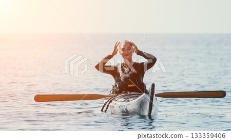 Kayaking Sea Water Sports Woman Enjoying Kayaking Trip at Sunset 133359406