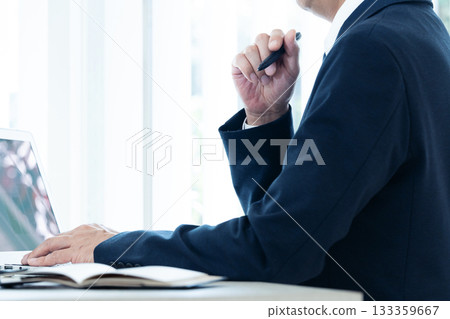 Middle-aged businessman working on a laptop 133359667
