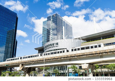 A train on the Wenhu or Brown Line of the Taipei MRT passes by the Taipei Nangang Exhibition Center Hall 1. A train on the Wenhu or Brown Line of the Taipei MRT passes by the Taipei Nangang Exhibition Center Hall 1. 133359968