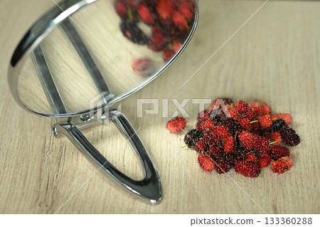 Fresh mulberries picked straight from the tree Fresh mulberries picked straight from the tree 133360288