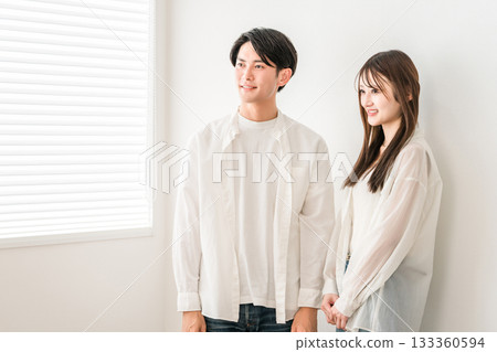 A young Asian couple in the living room of their home (marriage hunting, love hunting, partner, DINKS, lover, romance) A young Asian couple in the living room of their home (marriage hunting, love hunting, partner, DINKS, lover, romance) 133360594