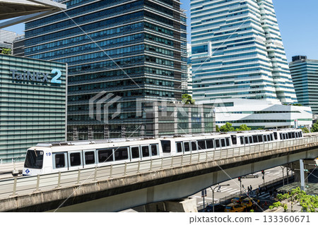 A train on the Wenhu or Brown Line of the Taipei MRT passes by the modern metropolis building in Nangang Software Park Area. A train on the Wenhu or Brown Line of the Taipei MRT passes by the modern metropolis building in Nangang Software Park Area. 133360671