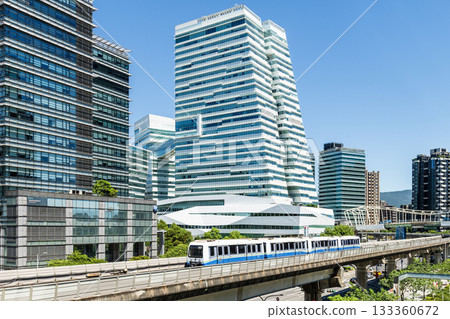 A train on the Wenhu or Brown Line of the Taipei MRT passes by the modern metropolis building in Nangang Software Park Area. A train on the Wenhu or Brown Line of the Taipei MRT passes by the modern metropolis building in Nangang Software Park Area. 133360672