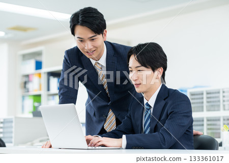 A young businessman working in the office A young businessman working in the office 133361017