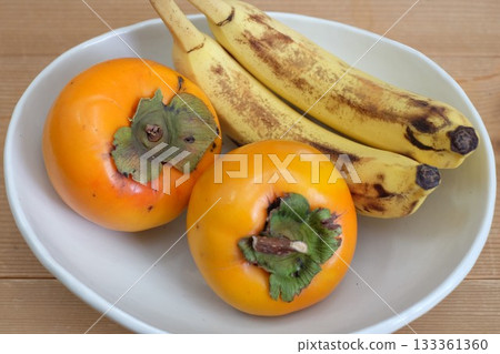 Persimmon and banana Persimmon and banana 133361360