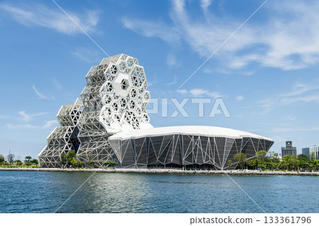 Close-up of Kaohsiung Music Center in Port of Kaohsiung, Taiwan. The white hexagonal building structure on the shore of Love Pier. Close-up of Kaohsiung Music Center in Port of Kaohsiung, Taiwan. The white hexagonal building structure on the shore of Love Pier. 133361796